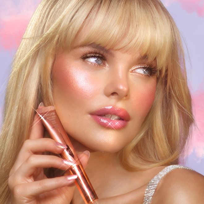 Pinkgasm Makeup Look model shot Meg wearing a pearlescent pink Pinkgasm makeup look using Charlotte's viral Beauty Light Wand liquid blush-highlighter