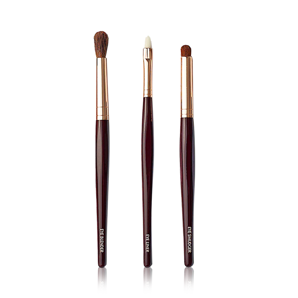 Three synthetic makeup brushes with black-brown handles and soft bristles.