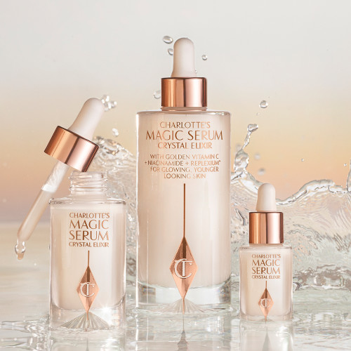 Extra large, regular, and travel-size, luminous, ivory-coloured serums in glass bottles with dropper lids. 