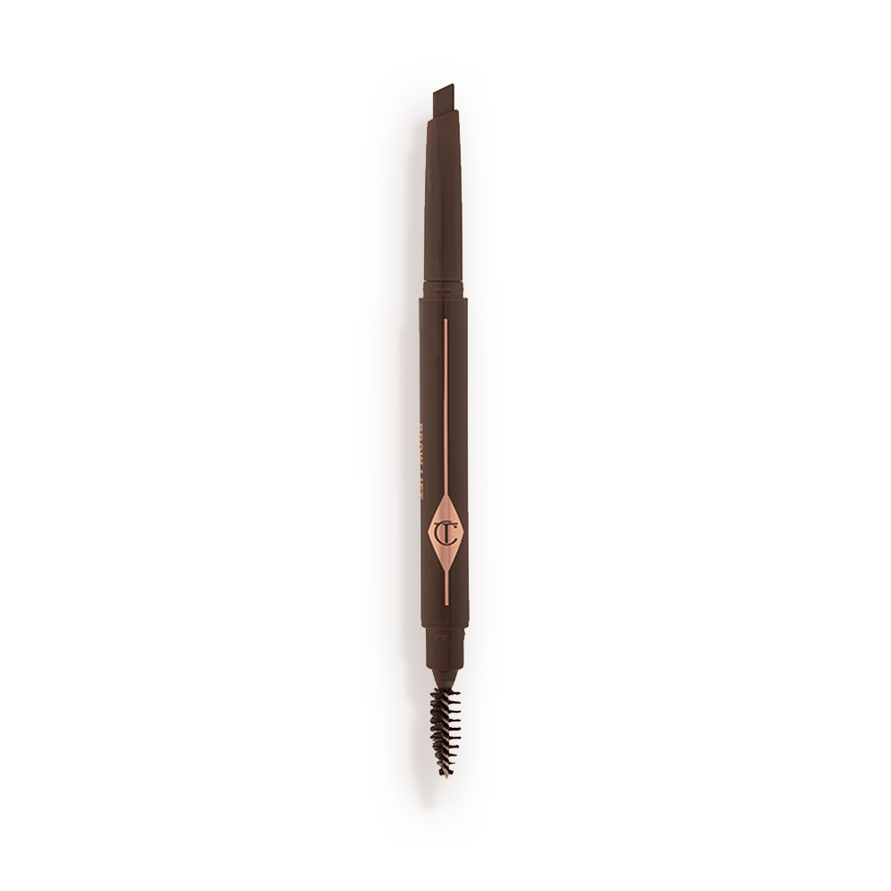 An open, double-ended eyebrow pencil and spoolie brush duo in a black brown shade with black-brown-coloured packaging 