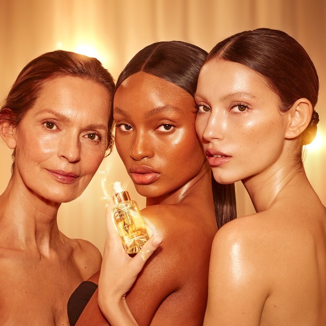 Three models holding Collagen Superfusion Facial Oil