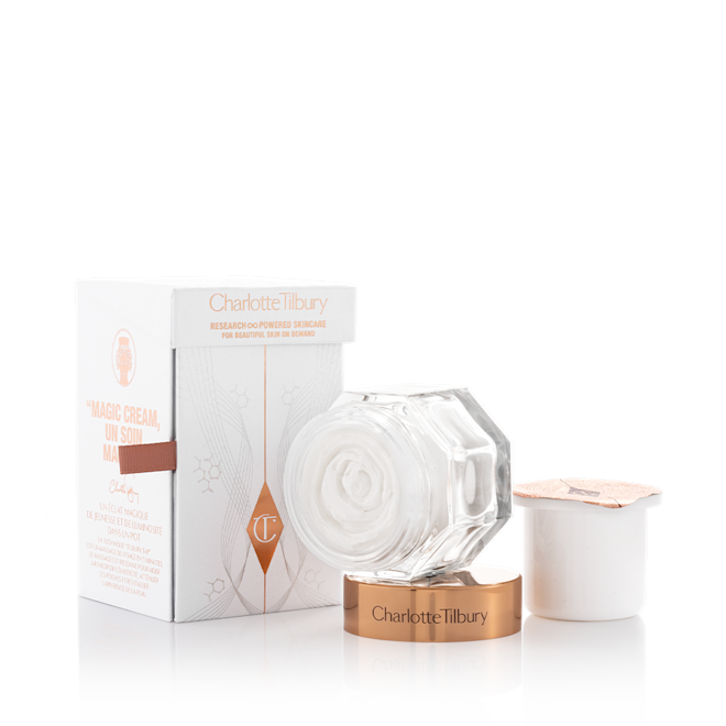 Magic Cream with refill bundle Pearly-white cream in a glass jar with a gold-coloured lid along with its packaging box refill in a white-coloured pot with an easy-to-peel-off cover.