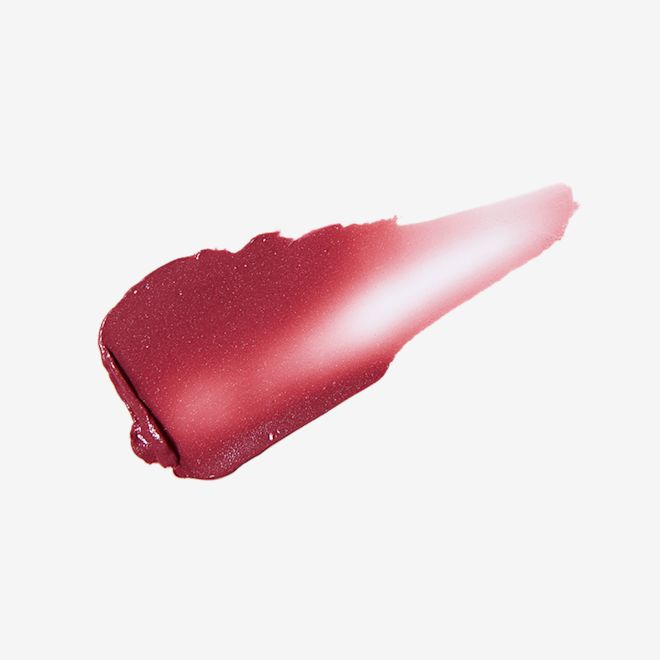 Pillow Talk Lip and Cheek Glow in Colour of Passion swatch Swatch of a cheek and eye cream in a dark berry-pink shade.