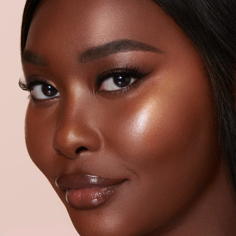 Goldgasm Beauty Light Wand on dark skin
