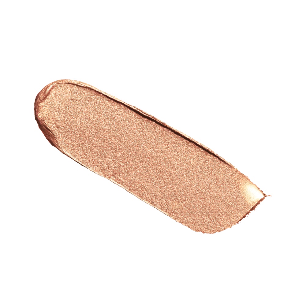 Swatch of a warm sunset gold cream eyeshadow.