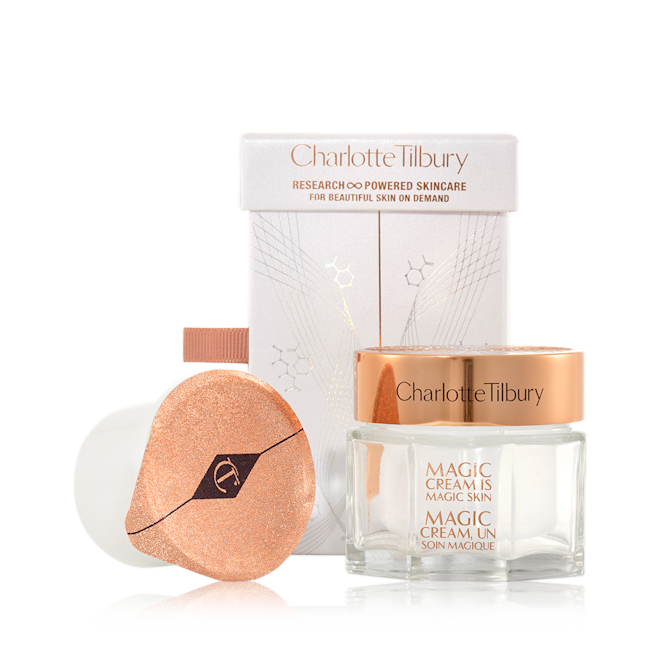 Magic Cream with refill gift set Pearly-white cream in a glass jar with a gold-coloured lid along with its packaging box refill in a white-coloured pot with an easy-to-peel-off cover.