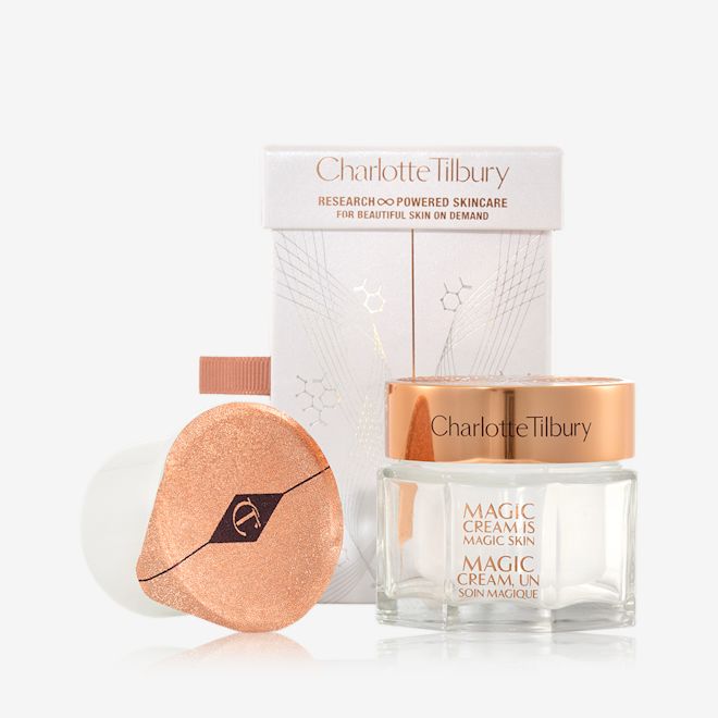Magic Cream with refill gift set Pearly-white cream in a glass jar with a gold-coloured lid along with its packaging box refill in a white-coloured pot with an easy-to-peel-off cover.