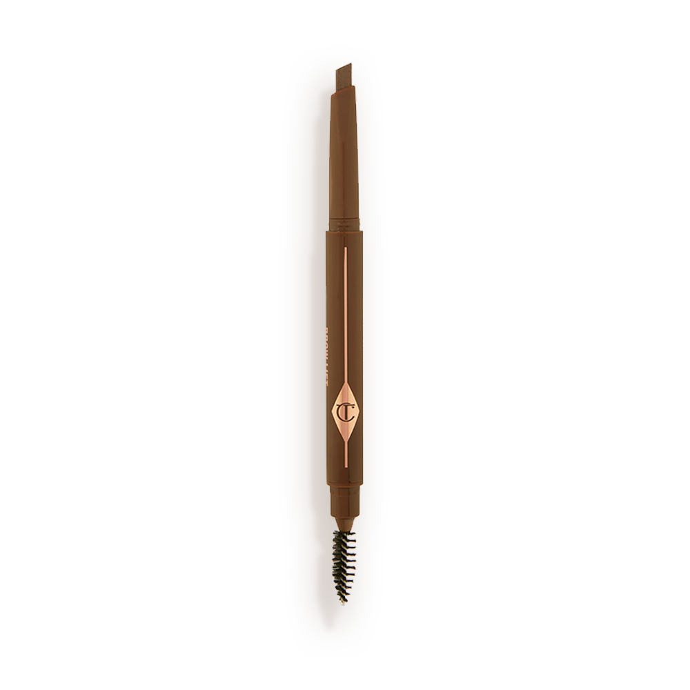 An open, double-ended eyebrow pencil and spoolie brush duo in a medium brown shade with medium-brown-coloured packaging 