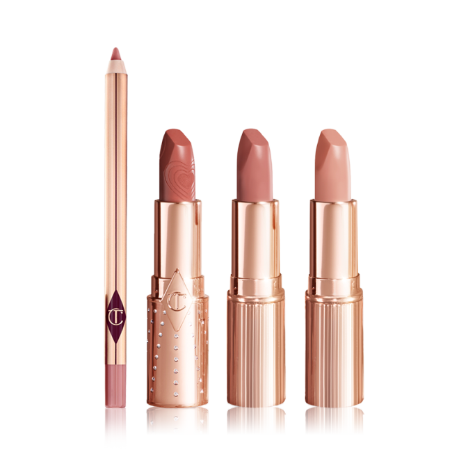 An open lip liner pencil in a nude pink shade with three open lipsticks in gold-coloured tubes with nude peach, nude brown peach, and nude peach beige colours. 