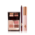 Quad, mirrored-lid eyeshadow palette with shimmery brown, gold, and pink eyeshadows with a berry-brown eyeliner pencil, and black mascara with nude pink bottle and gold-coloured lid.