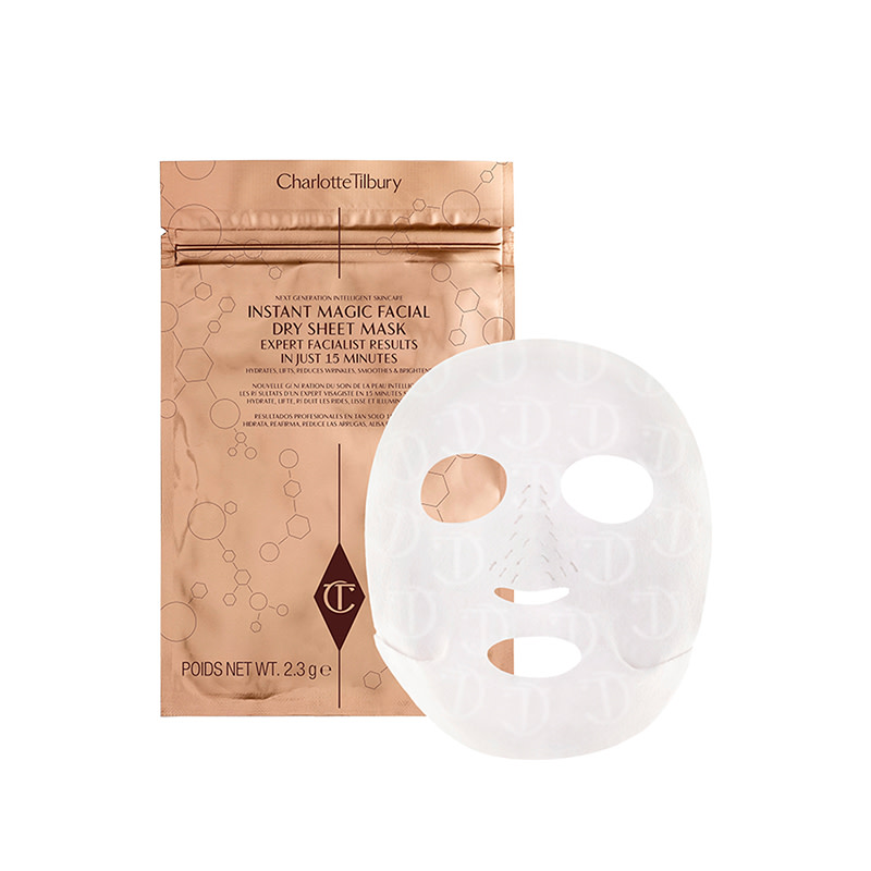 A white sheet mask for the face with rose-gold foil packaging. 
