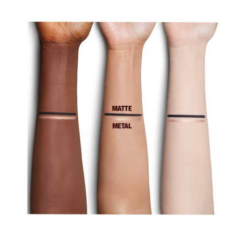 Fair, medium, and deep-tone arms with swatches of a duo eyeliner pencil in black and champagne-beige shades. 