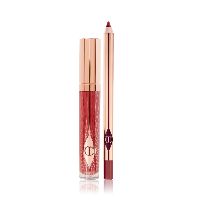 Lip gloss in a glass tube with a gold-coloured lid and lip liner pencil in berry-pink colours.