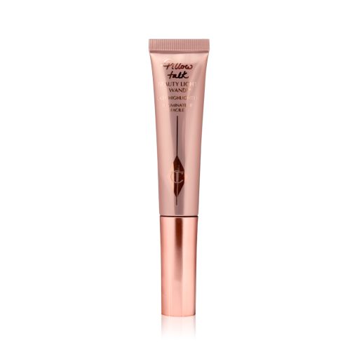Liquid highlighter wand in a reflective, pale pink tube with a rose gold cap.