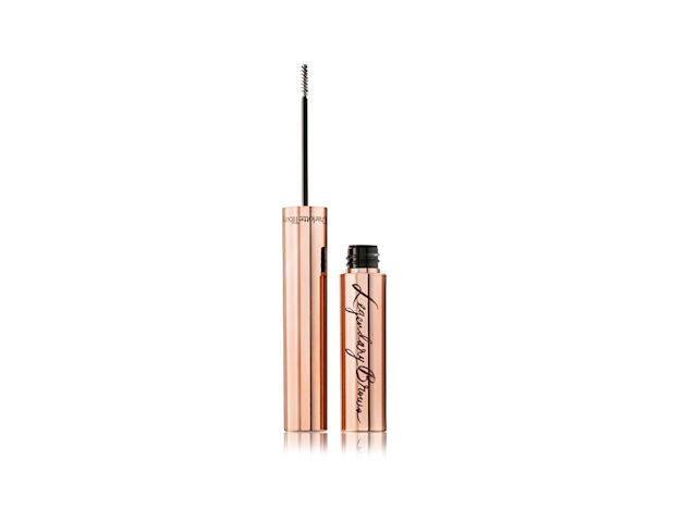 An open, tinted brow gel with a micro-precision brush in metallic, rose-gold-coloured packaging.