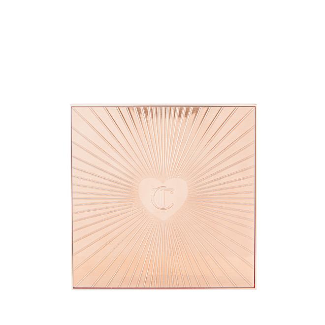 A closed, face palette with a rose-gold-coloured lid with a starburst pattern on top along with the CT logo embossed in the middle.