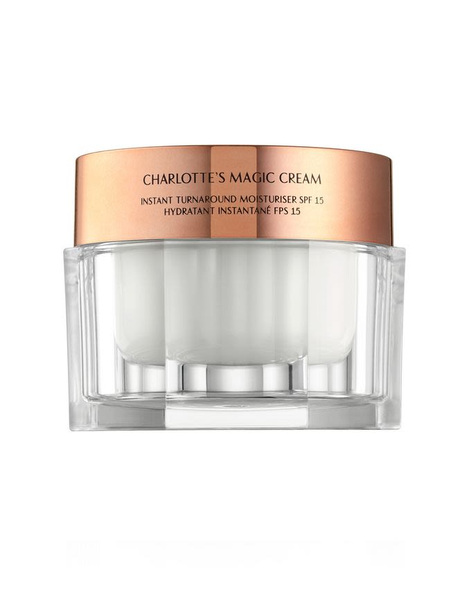 Pearly-white, thick and luscious face cream in a glass jar with a gold-coloured lid with the CT initials on it.