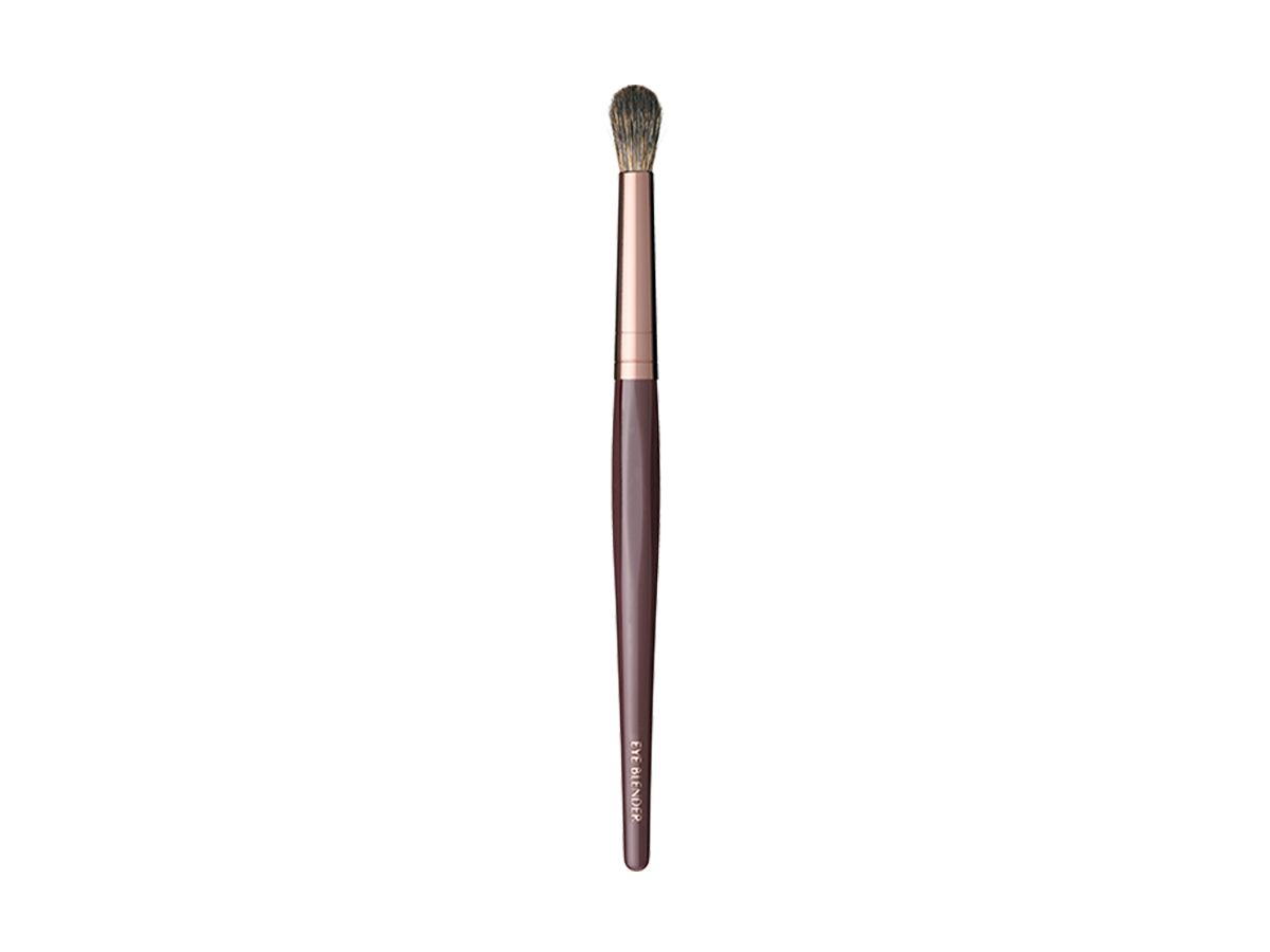 An eyeshadow blending brush in bronze and gold colour scheme.