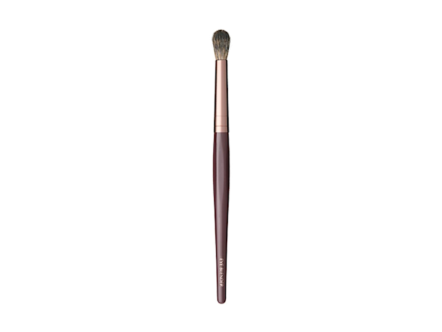 An eyeshadow blending brush in bronze and gold colour scheme.