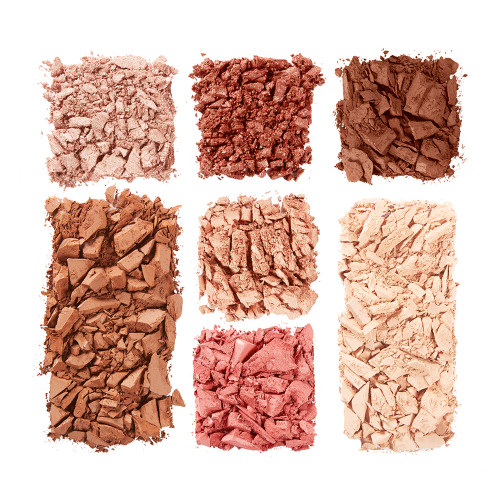 Swatches of a face palette that include three eyeshadows in rose gold, reddish-pink, and dark brown shades, blush and highlighter in medium-pink and rose-gold, and contour powders for light to medium skin tones.