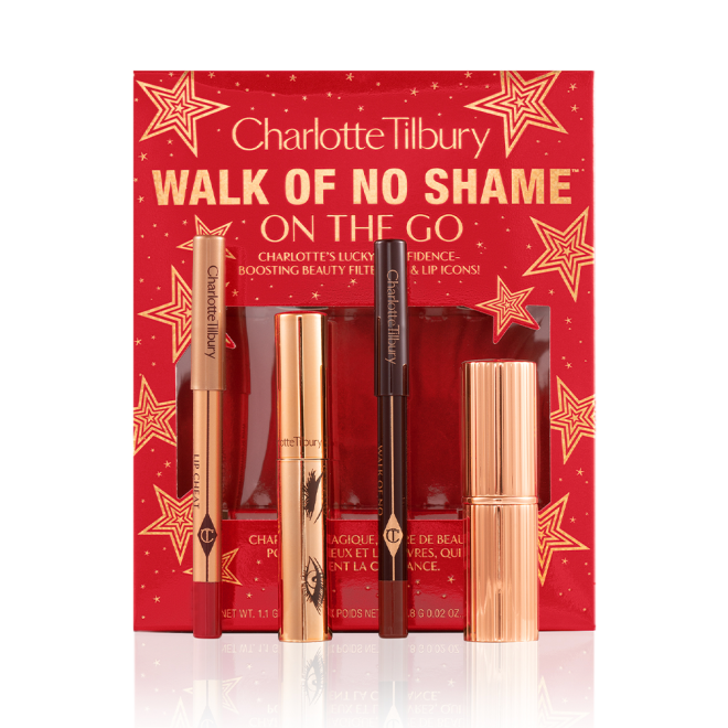 Eyeliner pencil in a berry-pink shade, mascara in a golden-coloured tube, lip liner pencil in berry-red shade, lipstick in a sleek, gold-coloured tube with red-coloured gift box with text on it reads, 'Walk of no shame on the go'.