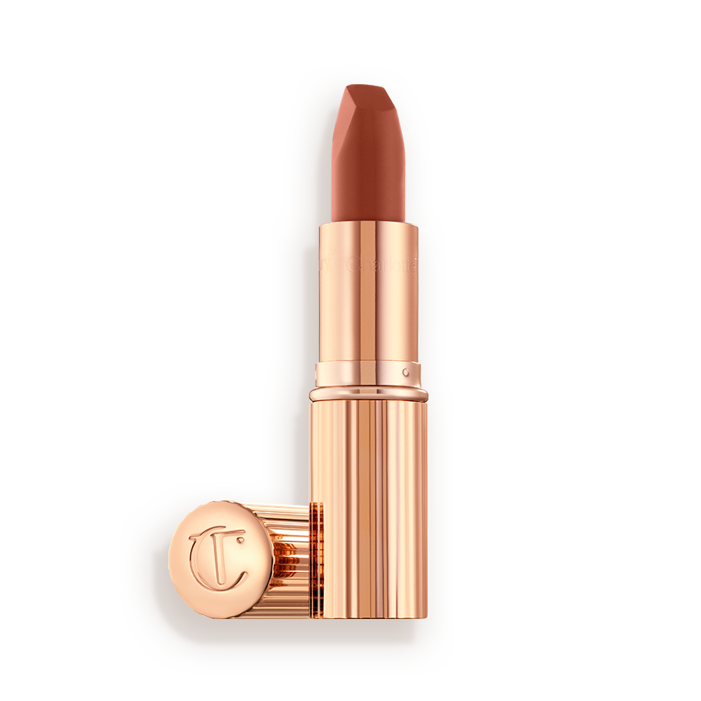 An open lipstick in a deep, sultry rose-brown nude shade with a matte finish.
