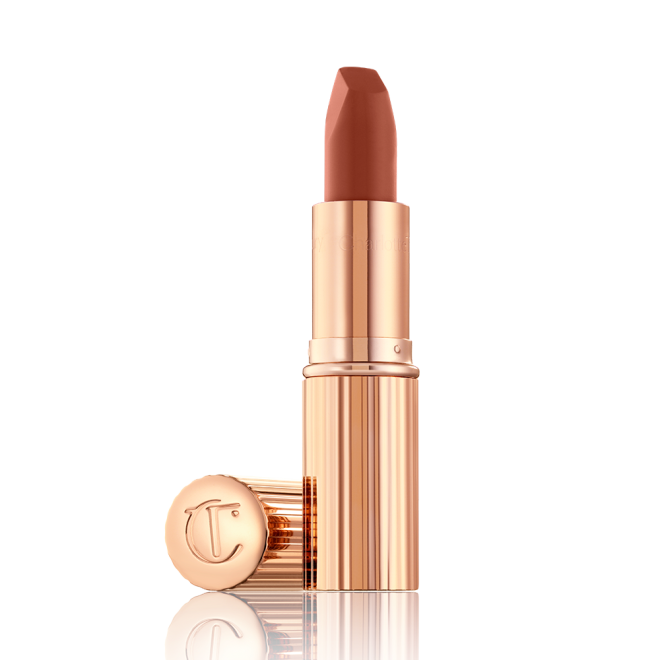 An open lipstick in a deep, sultry rose-brown nude shade with a matte finish.
