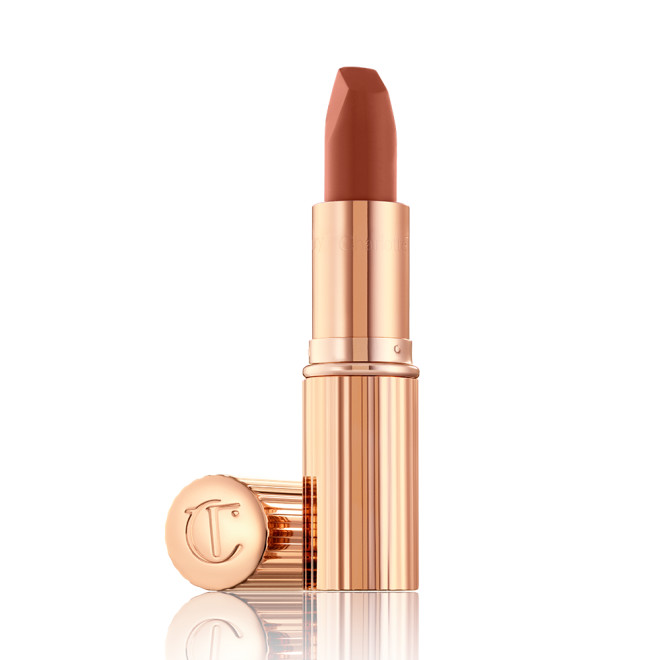 An open lipstick in a deep, sultry rose-brown nude shade with a matte finish.
