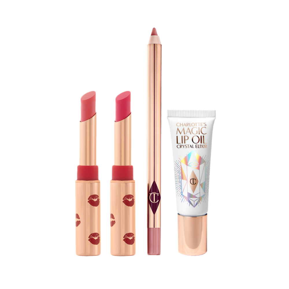 Two open lipsticks in burnt orange and bright pink colours with gold-coloured tubes with red-coloured kiss pattern all over, an open lip liner pencil in nude pink, and lip oil in a white-coloured tube with gold-coloured lids. 