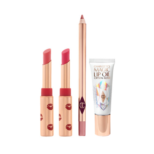 Two open lipsticks in burnt orange and bright pink colours with gold-coloured tubes with red-coloured kiss pattern all over, an open lip liner pencil in nude pink, and lip oil in a white-coloured tube with gold-coloured lids. 