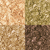 Swatches of four, matte and shimmery eyeshadows in olive, khaki-green, and golden shades. 