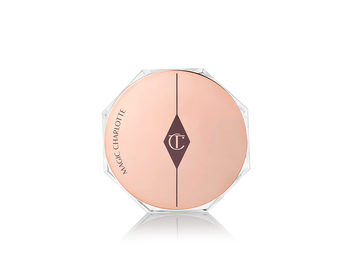 A glass jar with a gold-coloured engraved lid with the CT logo printed on top. 