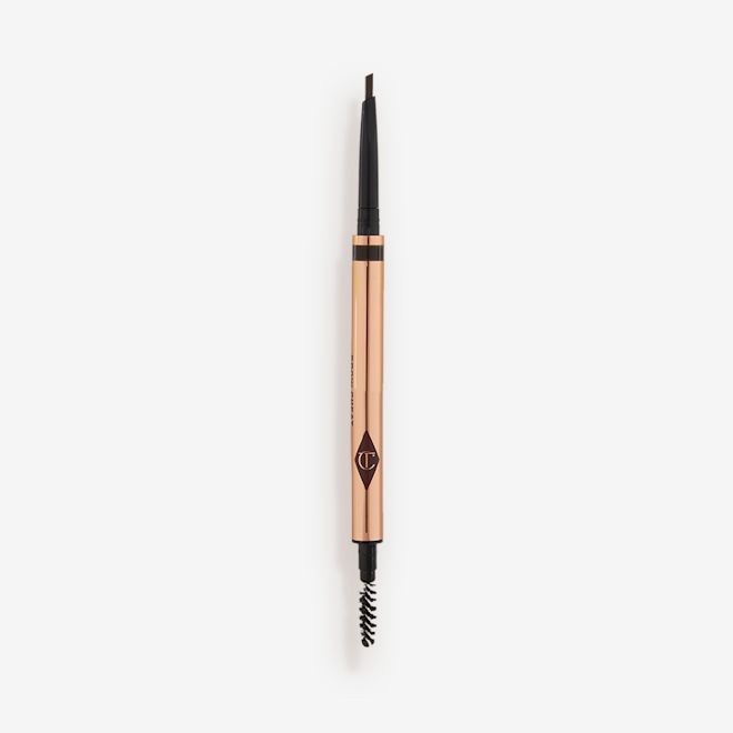 Brow Cheat in Natural Black open A double-ended eyebrow pencil and spoolie brush duo in a black shade with gold-coloured packaging.