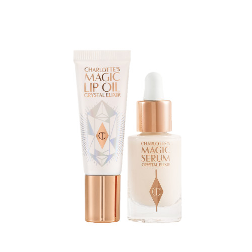Travel-size lip oil in a white-coloured tube with a gold-coloured lid and a mini, glow-enhancing serum in a glass bottle with a gold and white-coloured dropper lid.