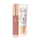 Lip and cheek tint in a brown-pink shade with a golden-coloured lid and lip oil in a white-coloured tube with a gold-coloured tube. 