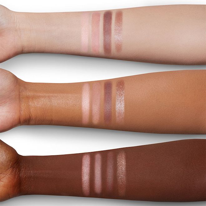 Luxury Palette in Pillow Talk arm swatches Arm swatches of a quad eyeshadow palette with light pink, dark pink, dark brown, and light brown eyeshadow.
