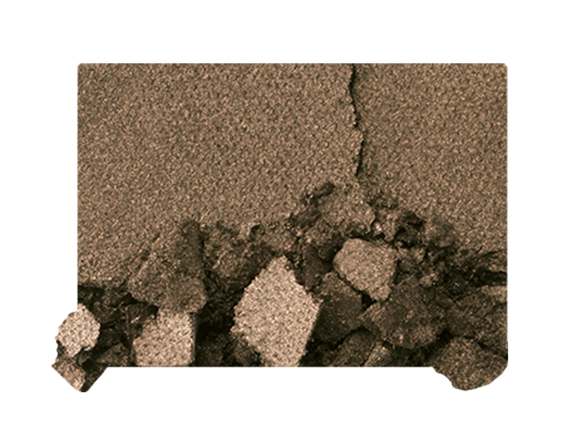 Swatch of a shimmery, powder eyeshadow in a smokey green shade. 