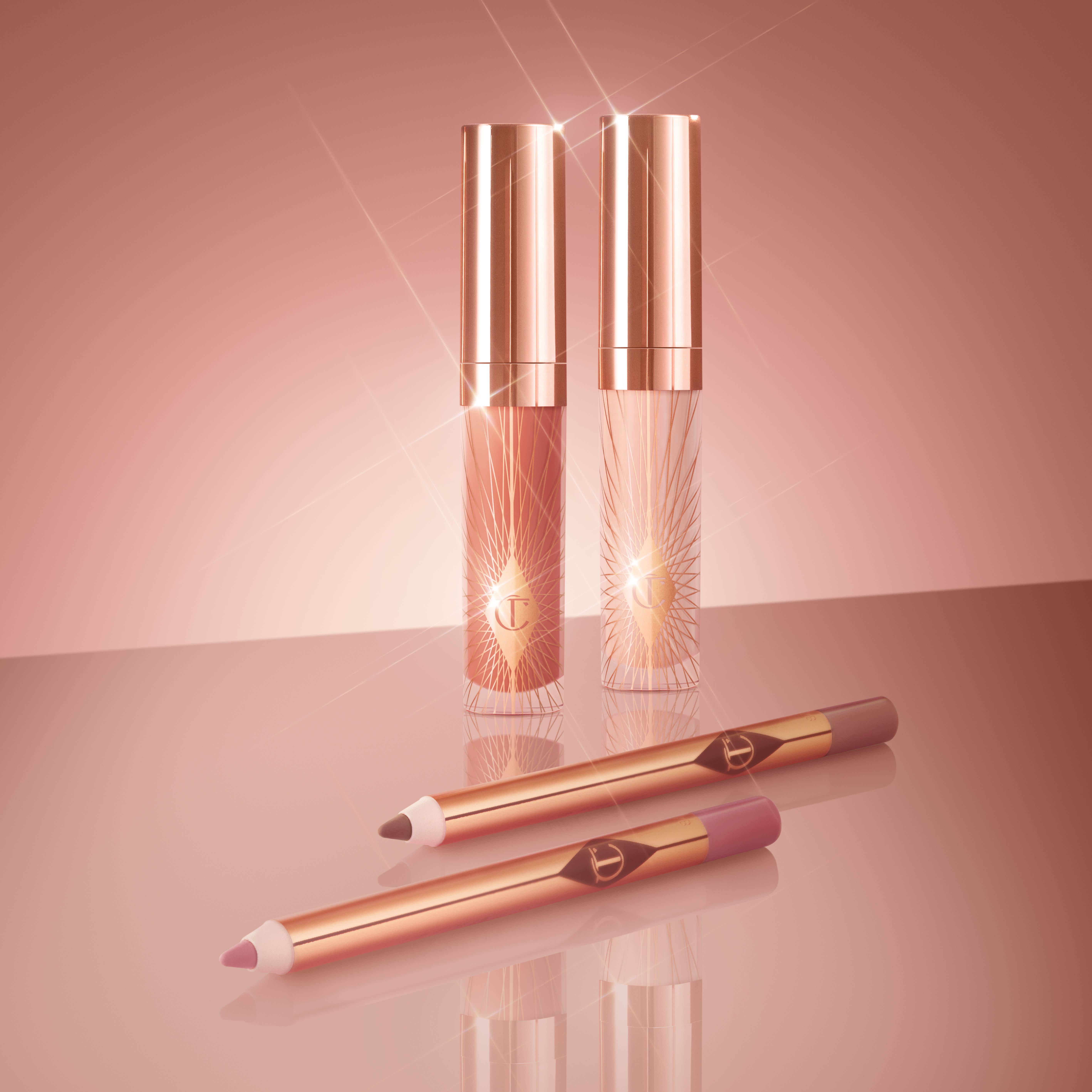 Charlotte's new Glossy Lip Duo lip kits with travel-sized Lip Cheat lip liners and Collagen Lip Bath lip glosses