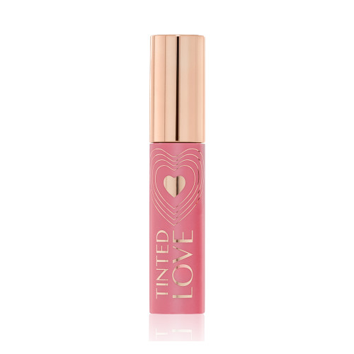 A closed lip and cheek tint with a gold-coloured lid in a soft nude pink-coloured tube.