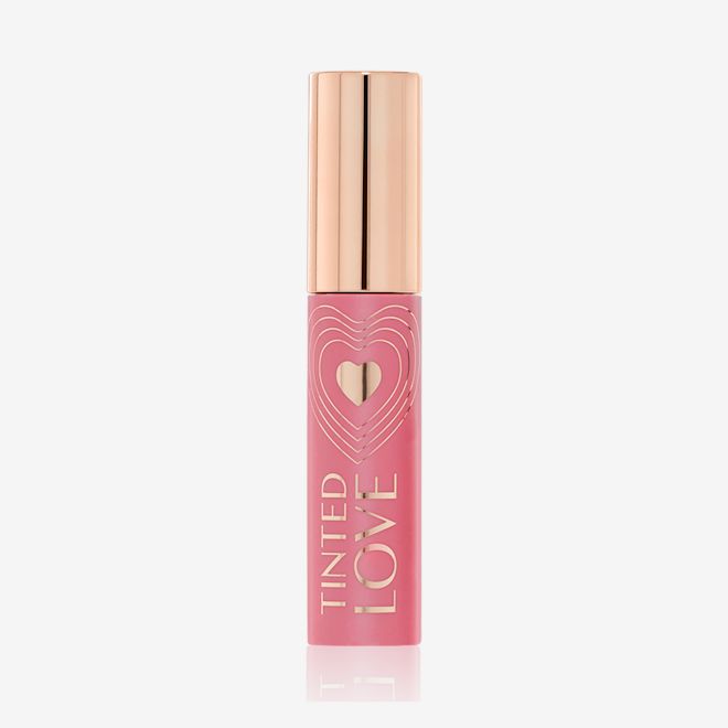 Tinted Love in Petal Pink closed A closed lip and cheek tint with a gold-coloured lid in a soft nude pink-coloured tube.