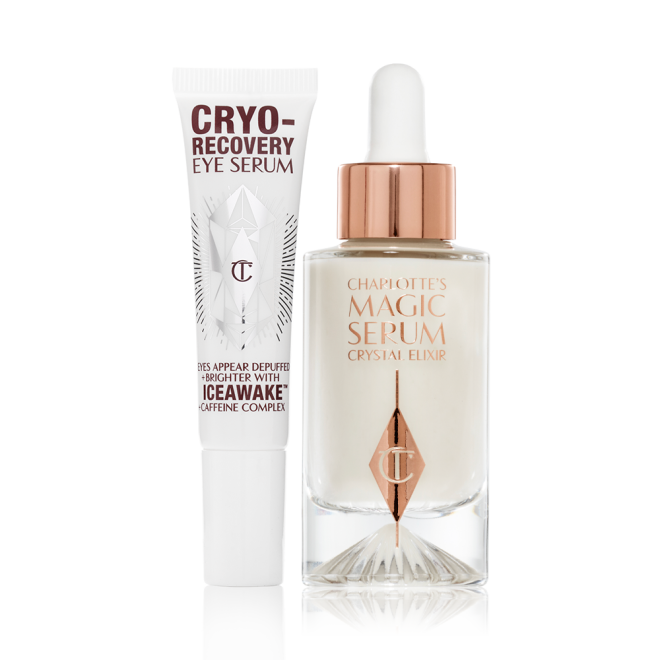 Eye serum in a white-coloured tube with geometric patterns on the front in a reflective, silver colour along with luminous, facial serum in a glass bottle with a white and gold dropper lid.