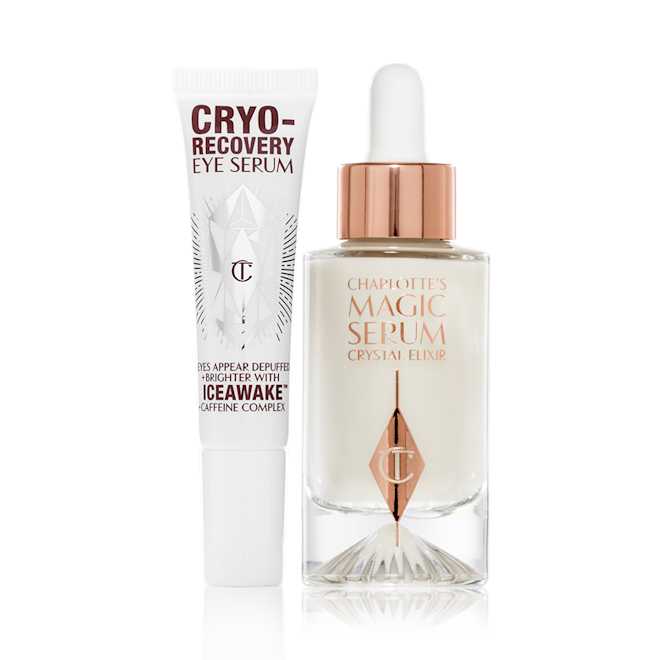 Cryo-Recovery Eye Serum and Magic serum closed Eye serum in a white-coloured tube with geometric patterns on the front in a reflective, silver colour along with luminous, facial serum in a glass bottle with a white and gold dropper lid.