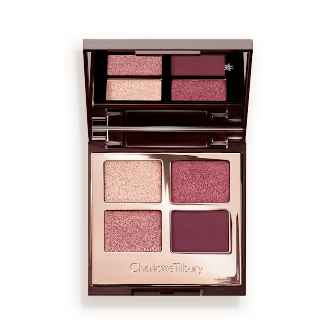 Luxury Palette in Mesmerising Maroon eyeshadow palette lid open A mirrored-lid, quad eyeshadow palette with eyeshadows in shades of pink, plum, and champagne.