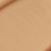 Close-up swatch of a skin-like, glowy foundation in a medium brown-beige shade.