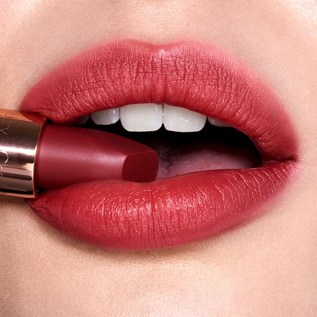 Close up on redheaded model wearing Walk of No Shame red lipstick