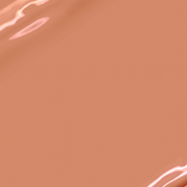 Swatch of a warm, brownish peach nude lipstick with a satin finish.