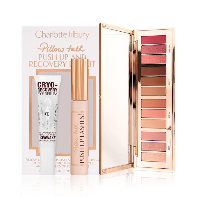 Eye serum in a white-coloured bottle, black mascara in a nude pink tube with a gold-coloured lid, and an open, 12-pan eyeshadow palette with matte and shimmery eyeshadows in shades of pink, brown, and gold.