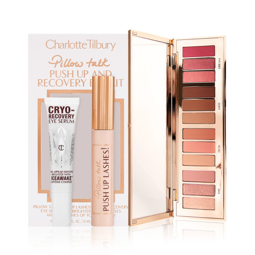 Eye serum in a white-coloured bottle, black mascara in a nude pink tube with a gold-coloured lid, and an open, 12-pan eyeshadow palette with matte and shimmery eyeshadows in shades of pink, brown, and gold.
