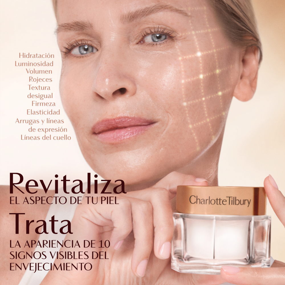 Una mano sosteniendo un tarro de crema de Charlotte Tilbury contra un fondo suave y de tonos cálidos. El texto de la imagen destaca los beneficios como una mejor hidratación, luminosidad, volumen, firmeza y reducción del enrojecimiento, textura desigual, pérdida de elasticidad, arrugas y líneas de expresión. El texto adicional dice: "Revive en 28 segundos" e "Invierte los 10 signos visibles de la edad".