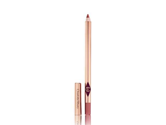 Warm berry-pink lip liner pencil with the cap next to it.
